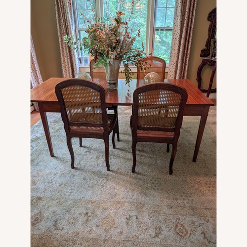 Used Dark Brown Wood Dining Table for sale on AptDeco