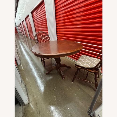 Used Dark Brown Dining Table and 3 Chairs  for sale on AptDeco