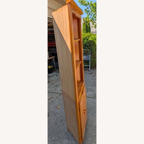 Used Brazilian Solid Pine Wood Corner Curio Cabinet for sale on AptDeco