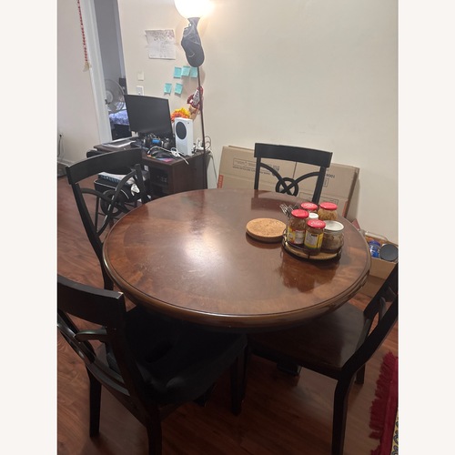 Used Dark Brown Wood Dining Table for sale on AptDeco
