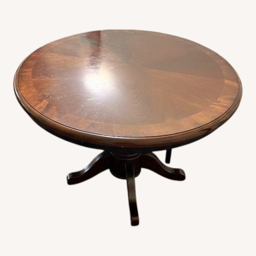 Used Dark Brown Wood Dining Table for sale on AptDeco