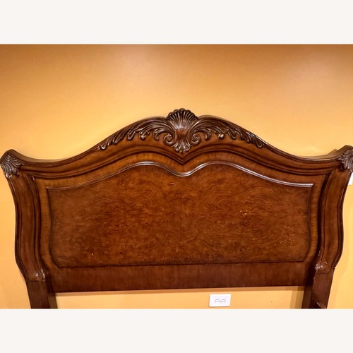 Used Dark Brown Wood Queen Bed for sale on AptDeco