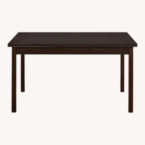 Used Scandinavian Designs Black Wood Dining Table for sale on AptDeco
