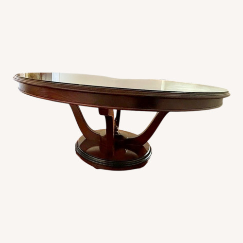 Used Round Wood Dining Room Table for sale on AptDeco