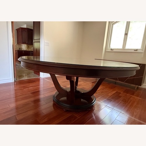 Used Round Wood Dining Room Table for sale on AptDeco