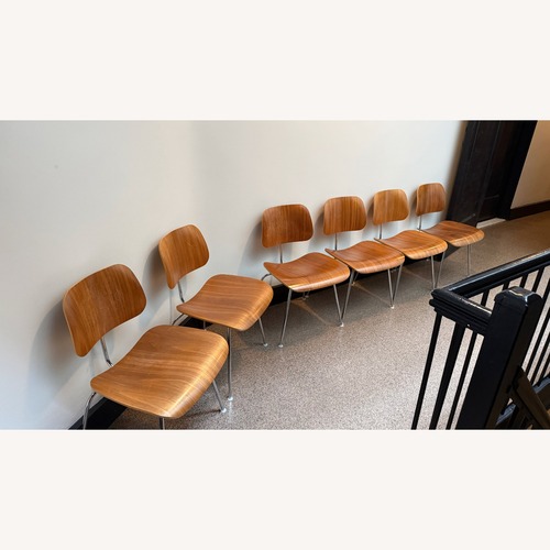 Used Herman Miller Eames Dining Chairs in Walnut for sale on AptDeco