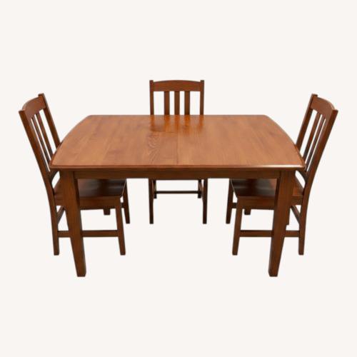 Used Dark Brown Wood Dining Set for sale on AptDeco