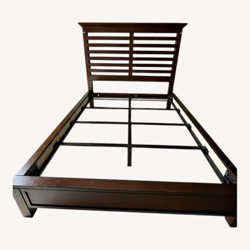 Used Macy's Tea Trade Dark Brown Wood Queen Bed for sale on AptDeco