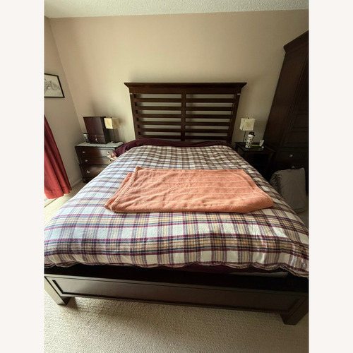 Used Macy's Tea Trade Dark Brown Wood Queen Bed for sale on AptDeco