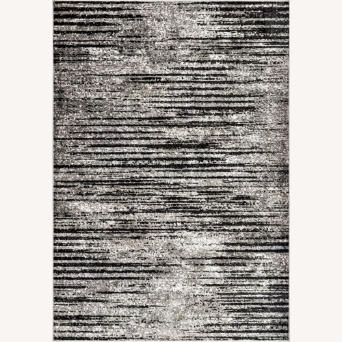 Used Contemporary Faded Elsa Grey 10x14 Area Rug for sale on AptDeco