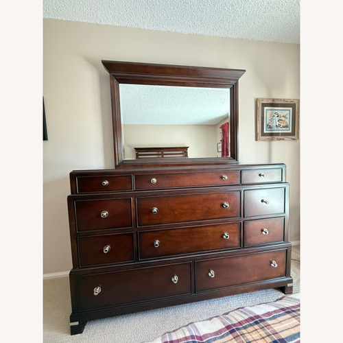 Used Macy's Tea Trade Dark Brown Wood Dresser and Mirror for sale on AptDeco