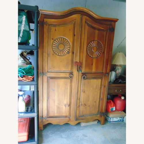 Used Vintage/Antique Finds Dark Brown Wood Armoire for sale on AptDeco
