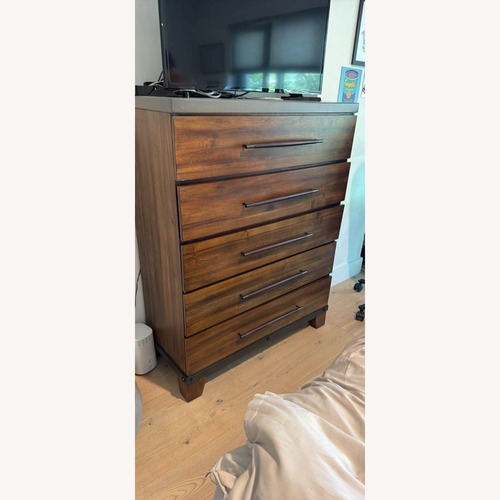 Used Raymour & Flanigan Dark Brown Wood Dresser for sale on AptDeco