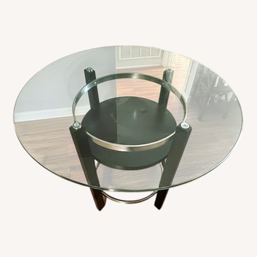 Used Dark Brown Wood Dining Table for sale on AptDeco
