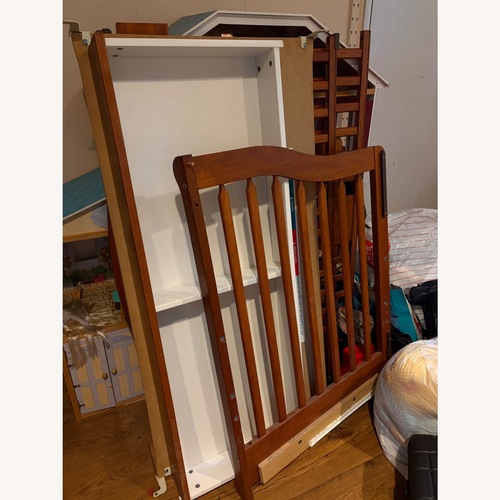 Used Wooden Crib With Winnie the Pooh Bedding for sale on AptDeco