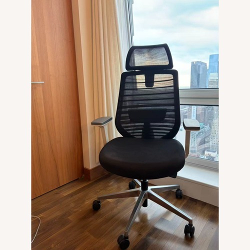 Used Branch Black Ergonomic Chair with Headrest for sale on AptDeco