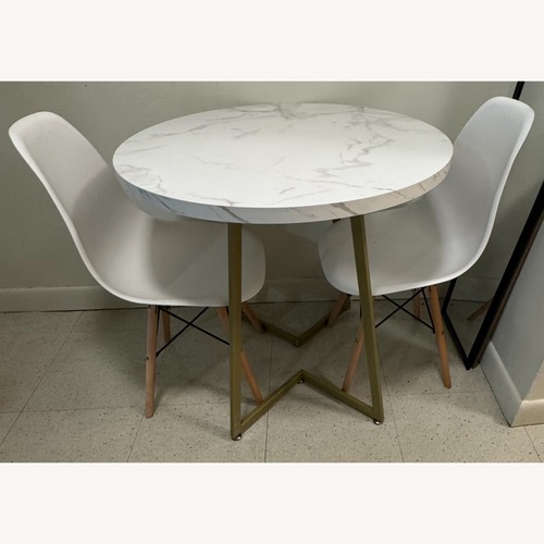 Used White Wood Dining Table with White Chairs Two for sale on AptDeco