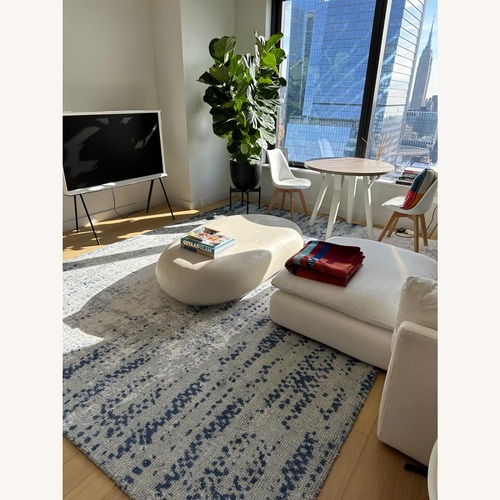 Used Crate & Barrel White Pebble 59" Coffee Table for sale on AptDeco