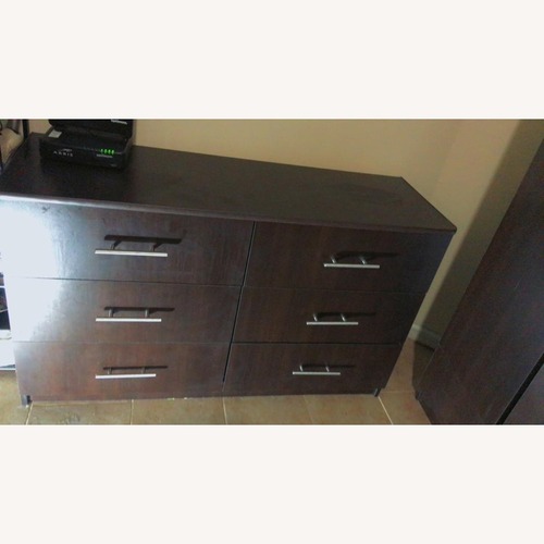 Used Dark Brown Wood Armoire for sale on AptDeco