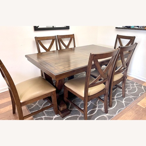 Used Costco Wooden Extendable Dining Set for sale on AptDeco