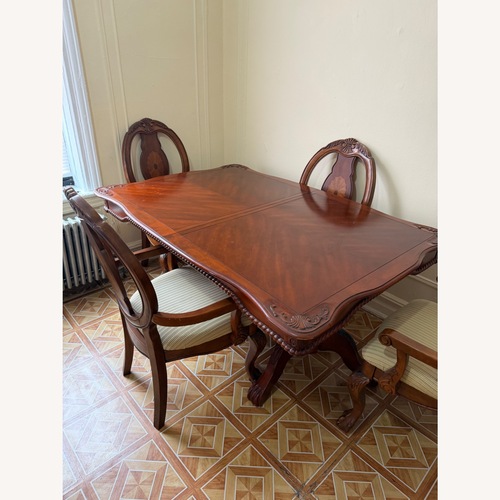 Used Wood Dining Table with 4 Chairs for sale on AptDeco