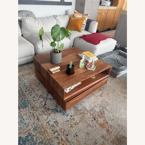 Used CB2 Dark Brown Spin Rotating Coffee Table for sale on AptDeco
