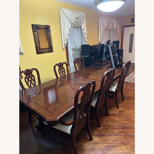 Used Dark Brown Wood Dining Table for sale on AptDeco