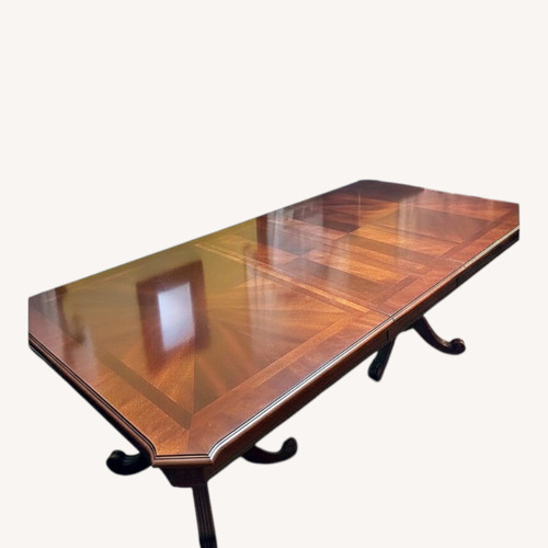 Used Dark Brown Wood Dining Table for sale on AptDeco