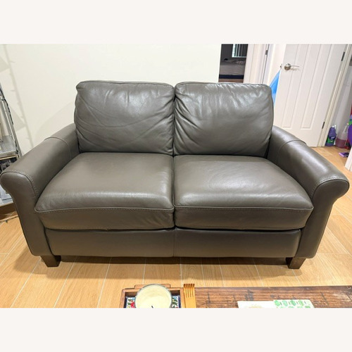 Used Dark Gray Leather Loveseat for sale on AptDeco