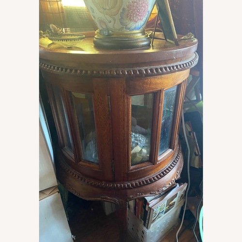Used Antique Bowed Curved Glass Curio Cabinet for sale on AptDeco