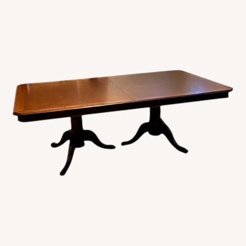 Used Ashley Furniture Dark Brown Wood Dining Table for sale on AptDeco