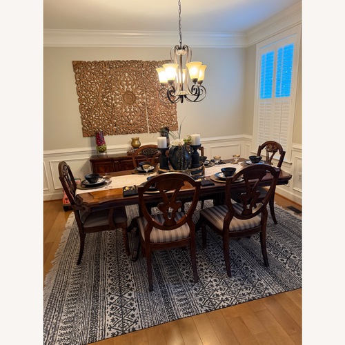 Used Ashley Furniture Dark Brown Wood Dining Table for sale on AptDeco