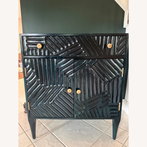 Used Hand Carved Paje Cabinet for sale on AptDeco