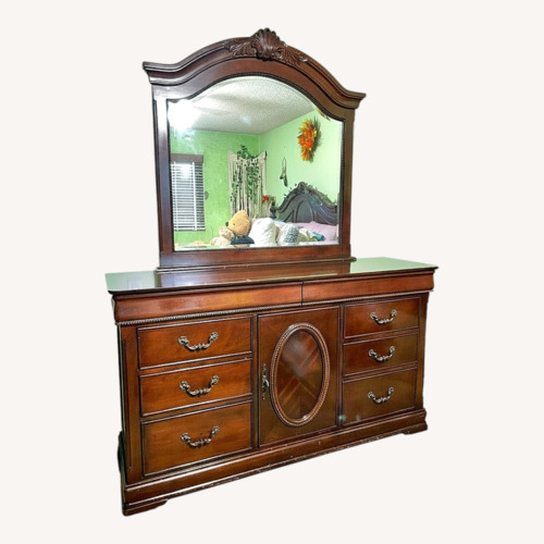 Used Dark Brown Cherry Wood Dresser for sale on AptDeco