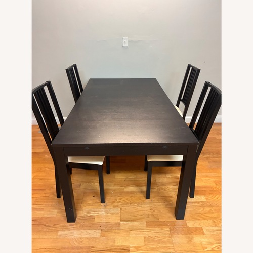 Used Extendable Black Wood Dining Table With 4 Chairs  for sale on AptDeco