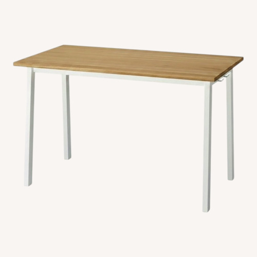 Used IKEA Natural Wood Dining Table for sale on AptDeco