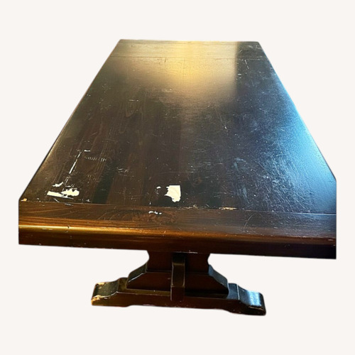 Used Dark Brown Wood Dining Table for sale on AptDeco
