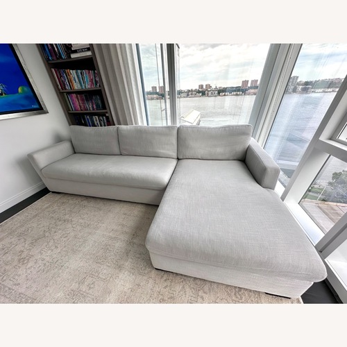 Used Light Gray Fabric Sleeper Sofa With Chaise Longue  for sale on AptDeco