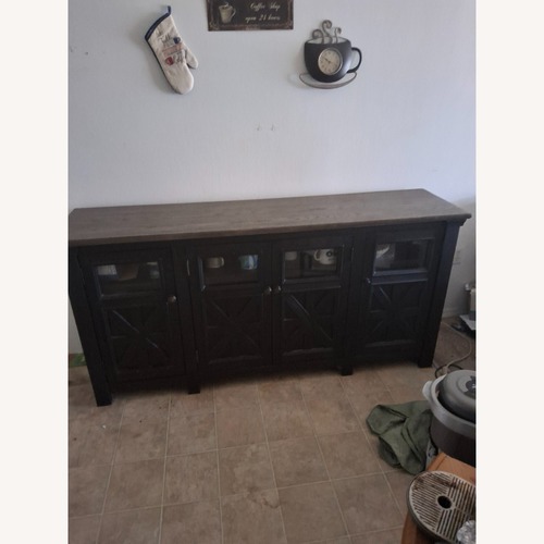 Used Ashley Furniture Tyler Black Wood Sideboard for sale on AptDeco