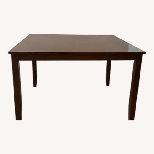 Used Ashley Furniture Dark Brown Wood Dining Table for sale on AptDeco