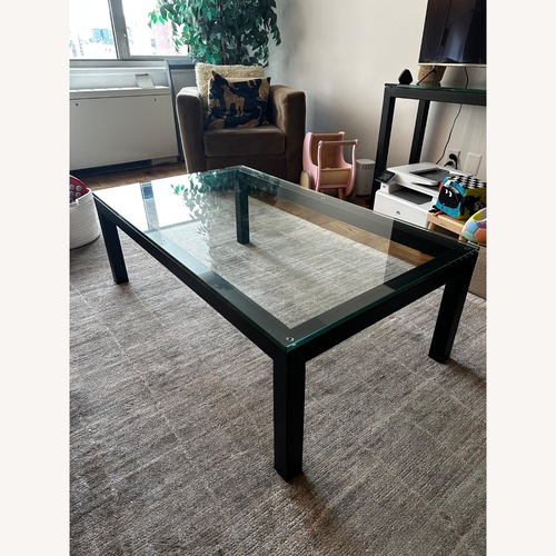 Used Crate & Barrel Parsons Black Glass Coffee Table for sale on AptDeco