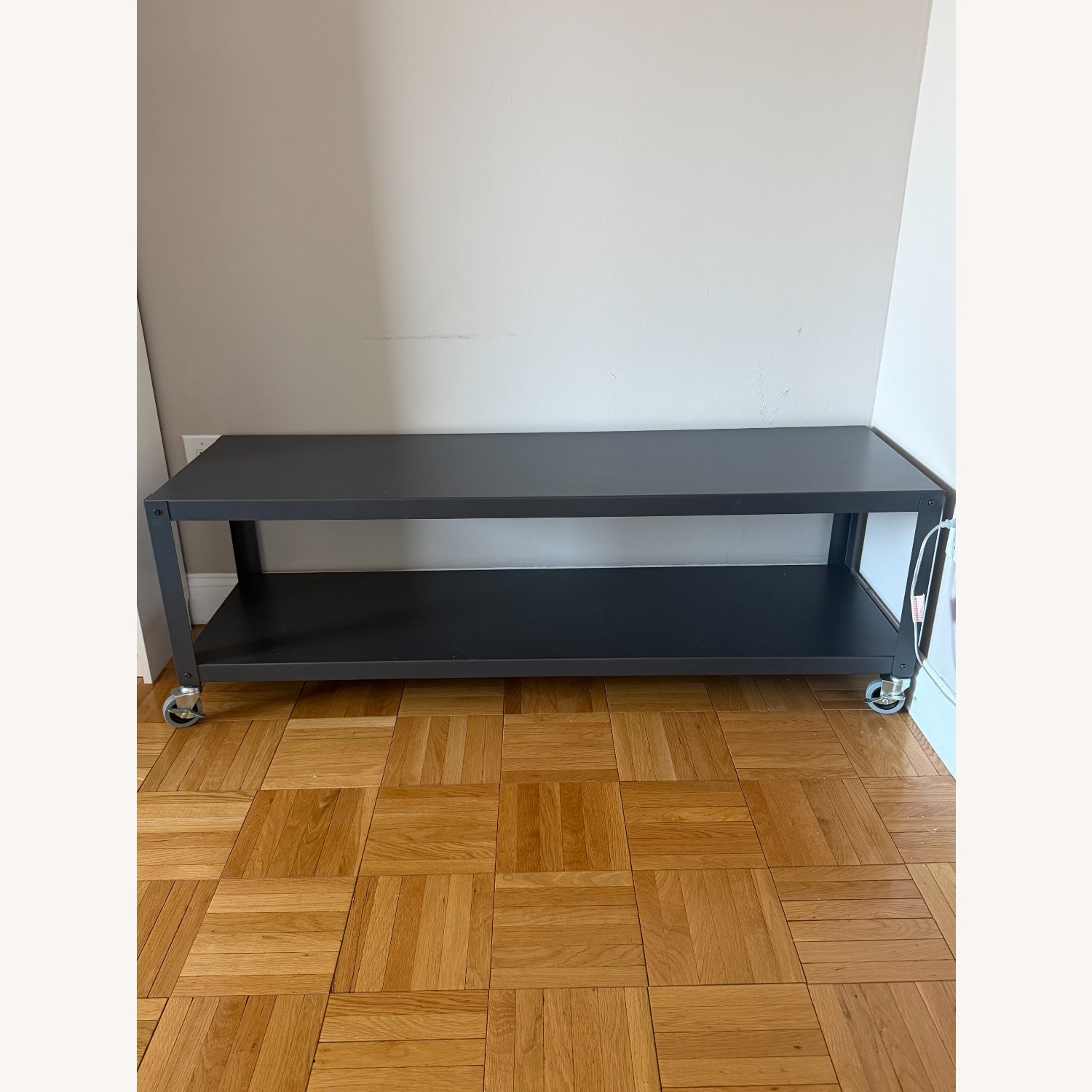 CB2 Black Metal Media Storage With Wheels - image-1