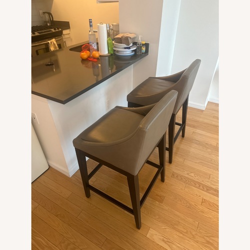 Used West Elm Curved Leather Stool for sale on AptDeco