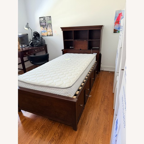 Used Jordan's Furniture Dark Brown Wood Twin Bed for sale on AptDeco