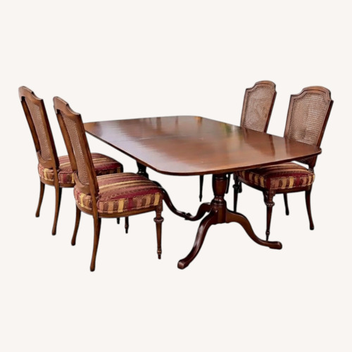 Used Classic Dining Table and Four Cane-Back Chairs for sale on AptDeco
