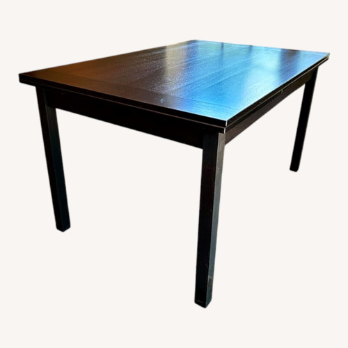 Used Black Wood Dining Table for sale on AptDeco