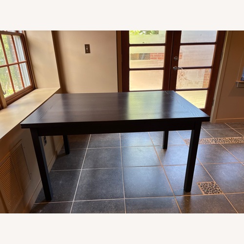 Used Black Wood Dining Table for sale on AptDeco
