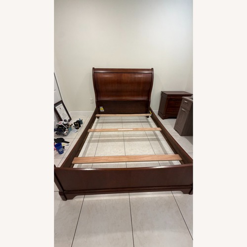 Used Cherry Wood Sleigh Full Size Bedframe for sale on AptDeco