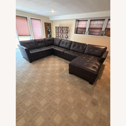 Used Macy's Dark Brown Leather 3+ Piece Sectional for sale on AptDeco