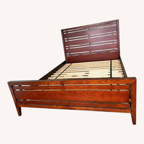 Used Dark Brown Wood Queen Bed for sale on AptDeco